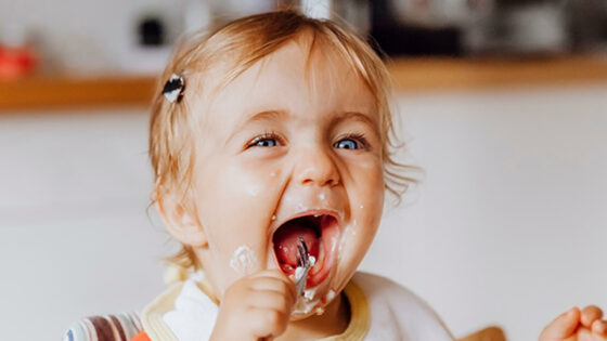 Toddler eating happily