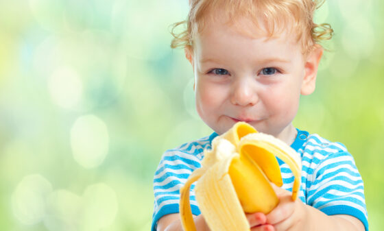 Child eating a banana