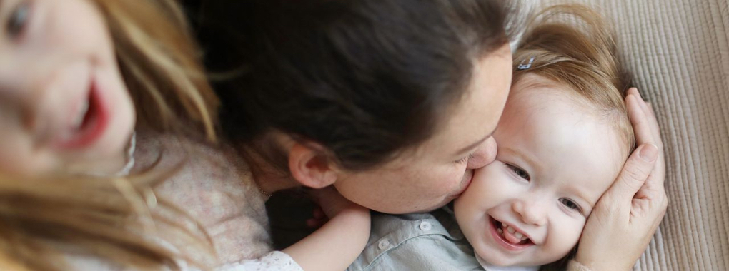 Mother and kids cuddling