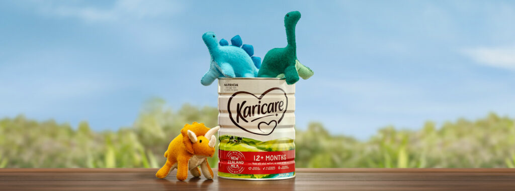 Dinosaurs in a Karicare toddler milk tin