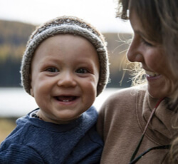 Baby smiling outside