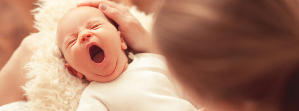 tired newborn baby ready for sleep